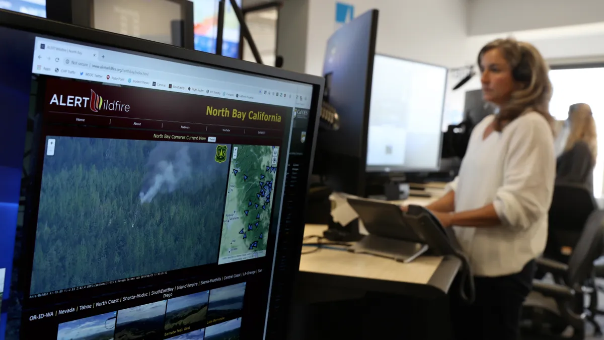 Pacific Gas and Electric (PG&E) Senior Wildfire Operations Center Analyst Sarah Gibson monitors a wildfire from the PG&E Wildfire Safety Operations Center on August 05, 2019 in San Francisco, Californ