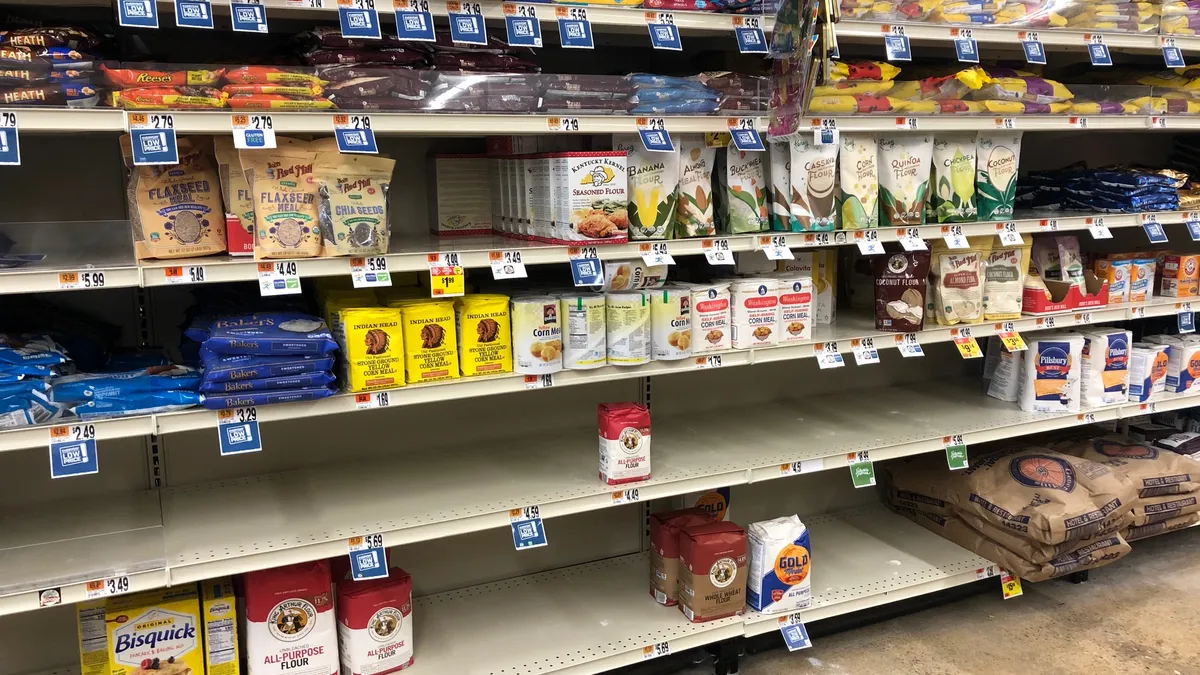 A grocery store's baking aisle is out of flour in June 2020.