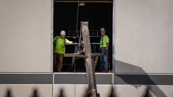 Workers seen in a unfinished building