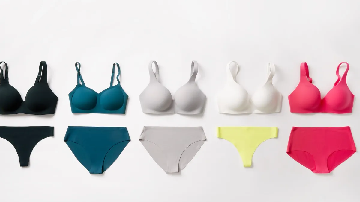 A lineup of bra and underwear sets in different colors on a white background.