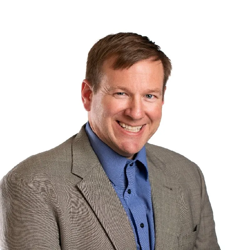 A professional headshot.