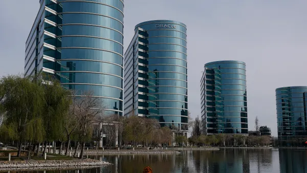 The Oracle logo is displayed on a building at an Oracle campus on March 10, 2025 in Redwood Shores, California.