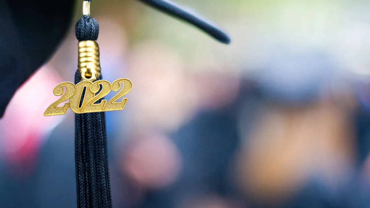 A tassel and gold "2022" hang from a mortarboard.