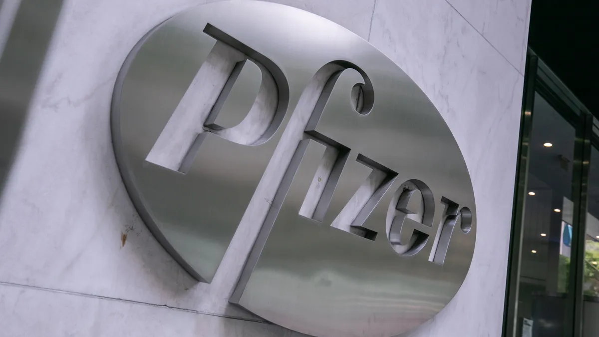 Pfizer's logo cast in metal.