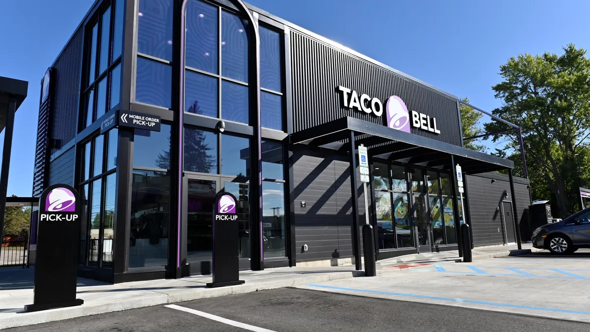 A black and purple restaurant exterior.