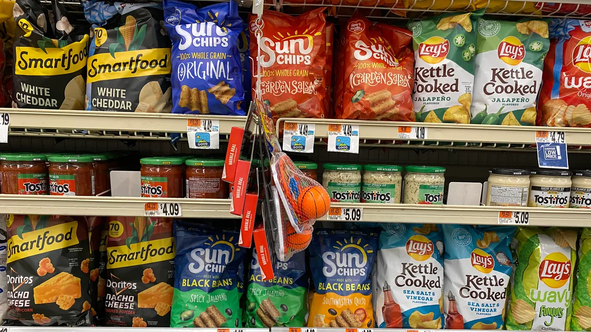 Snacking brands made by PepsiCo's Frito-Lay division on a grocery store shelf in Washington, D.C.