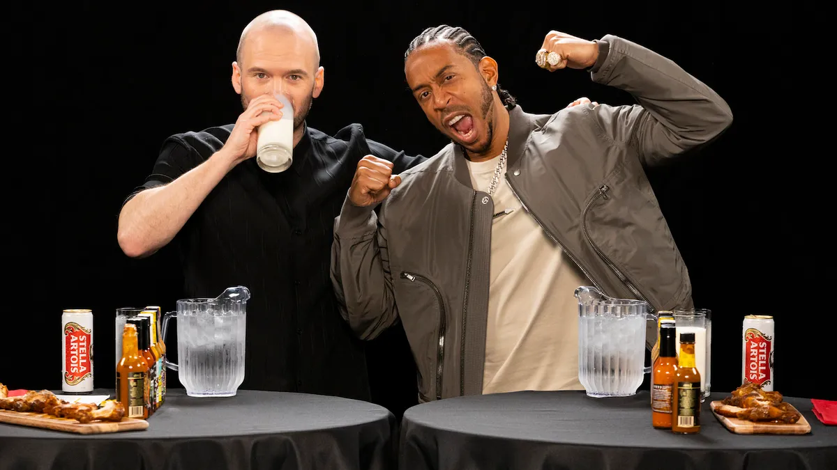 Hot Ones host Sean Evans and rapper Ludacris for Stella Artois