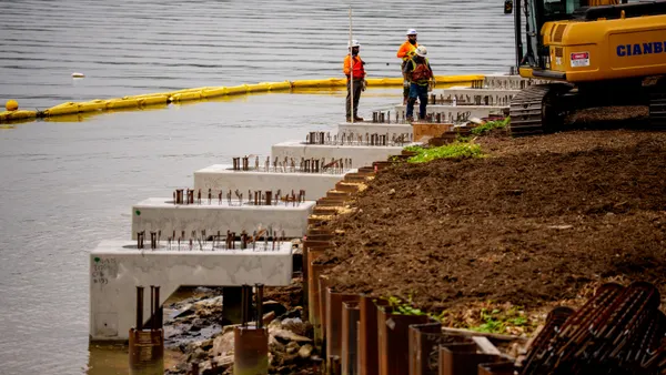 Laborers work on an upgraded river all at the Tidal Basin along the Potomac River