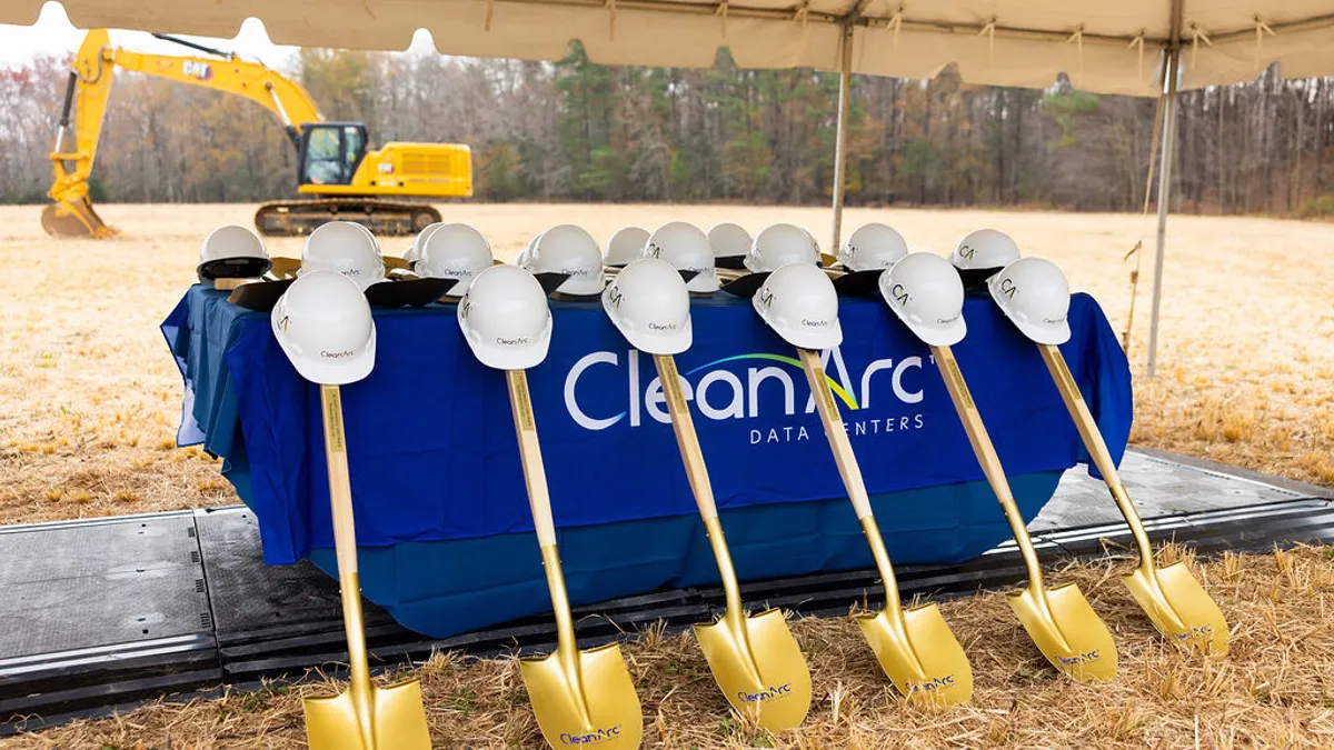 Shovels and construction helmets sit on the site of CleanArc’s planned data center campus