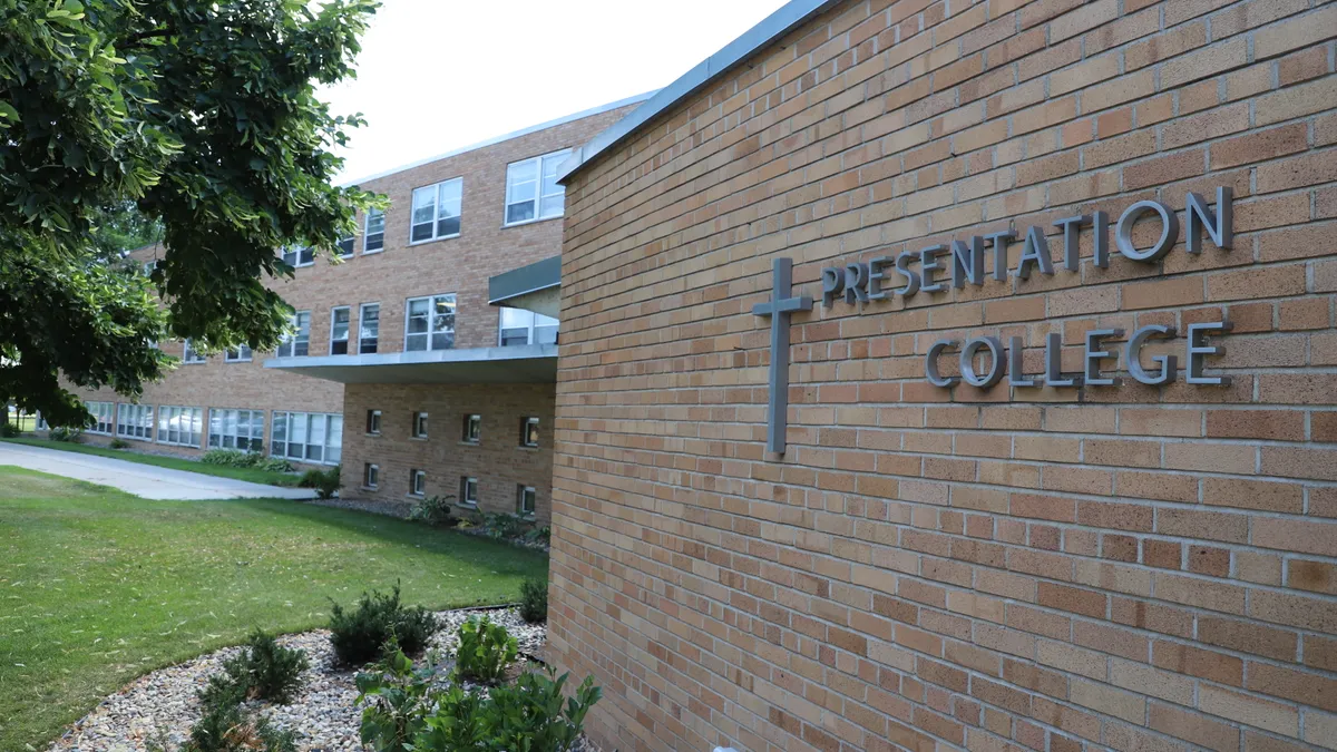 A brick wall bears the words "Presentation College."