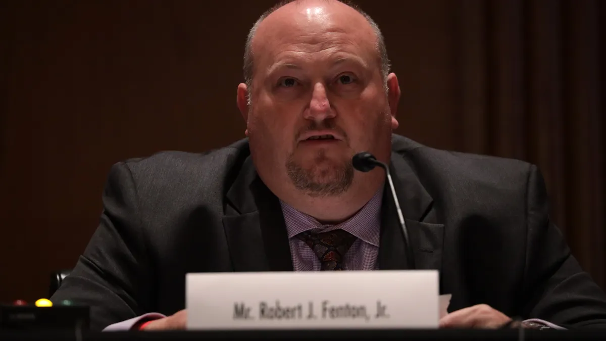Robert Fenton testifying at a senate committee hearing.