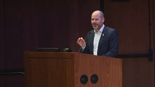 Nelson Switzer standing at a podium at DC Climate Week 2026