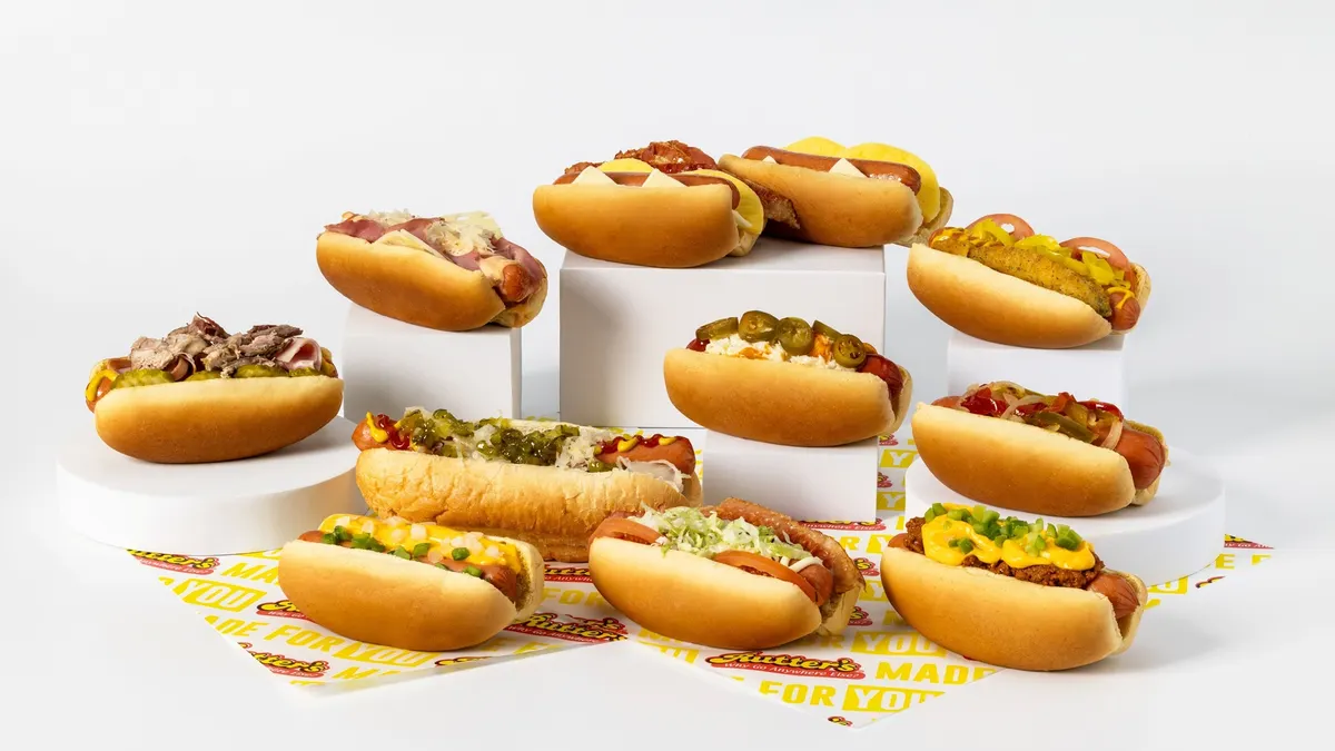 A photo of several hot dogs against a white background.