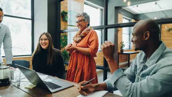 Age diverse group of people in a meeting