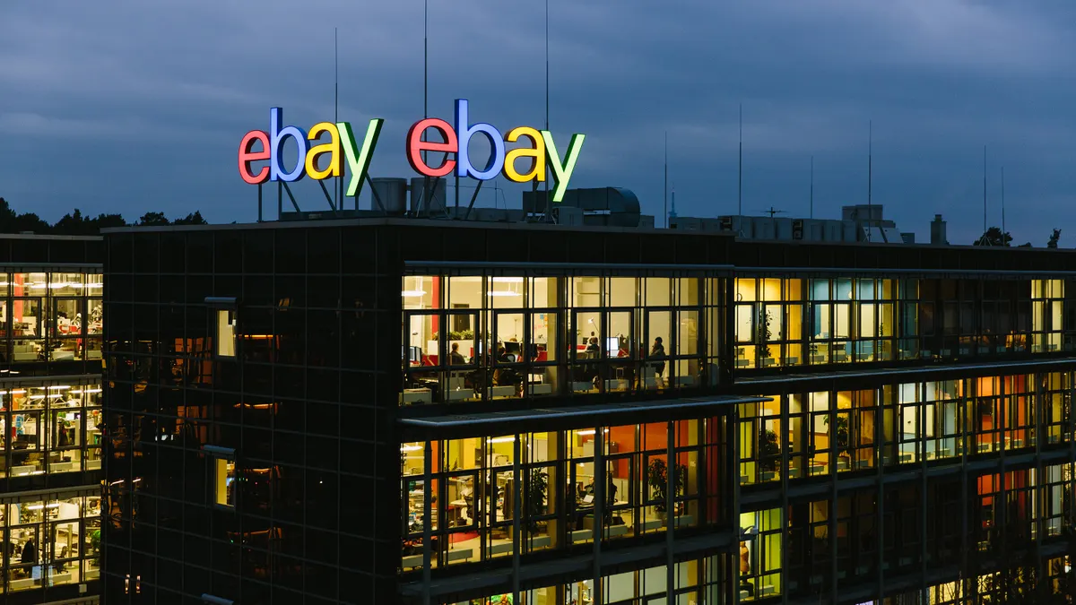 An eBay office building at night, with lit office windows.