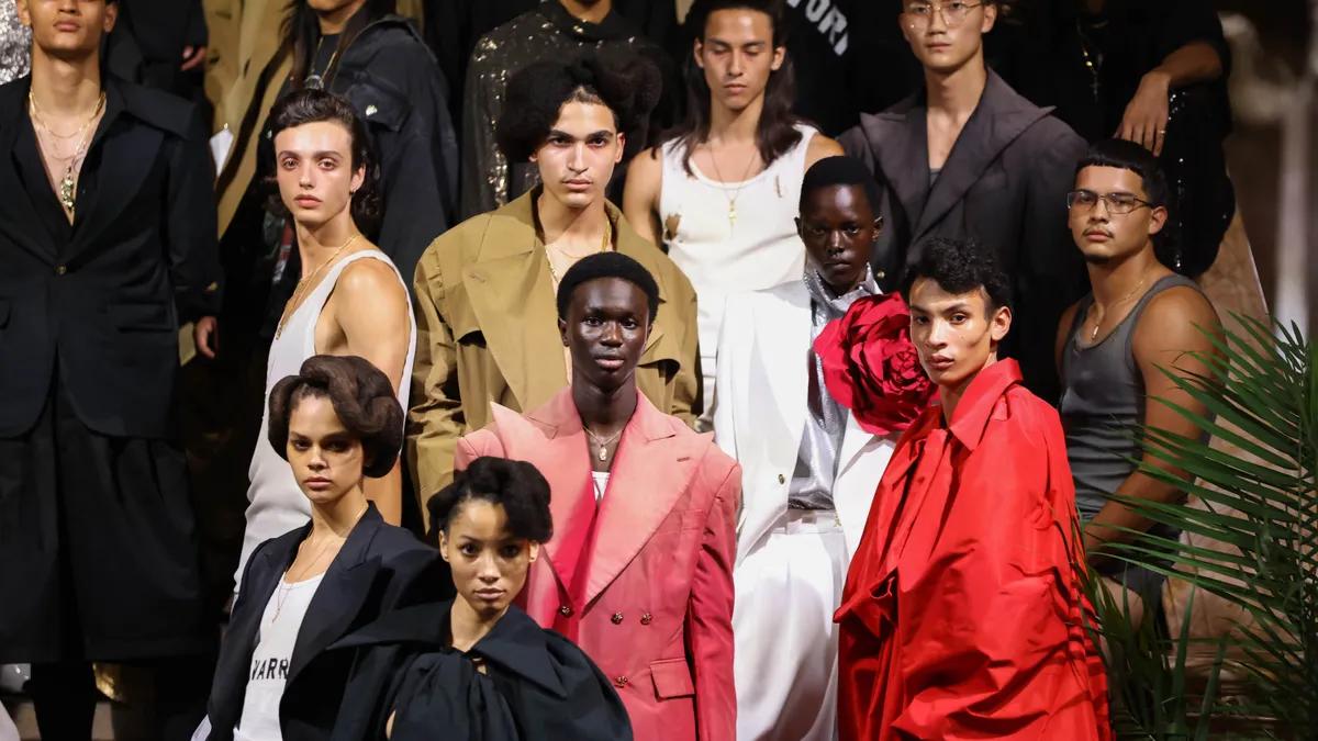 Models pose on the runway wearing colorful clothes at the Willy Chavarria fashion show.