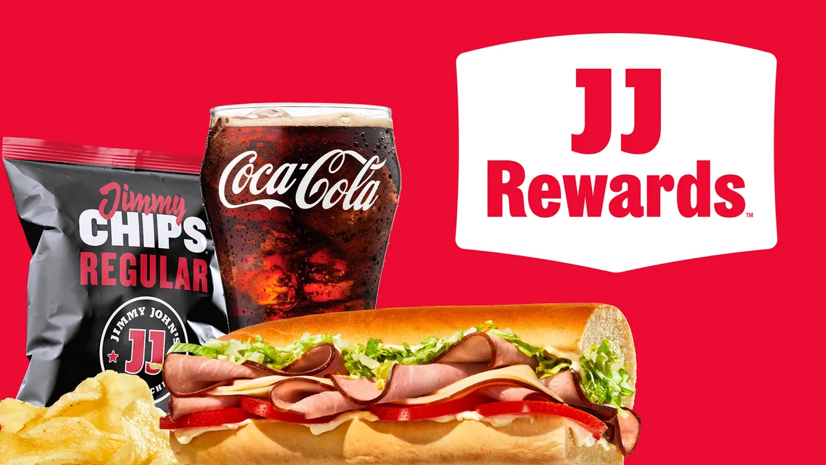 A sandwich, a bag of chips, a coke, a red background.