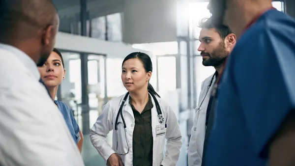 Photo of a team of doctors having a discussion.