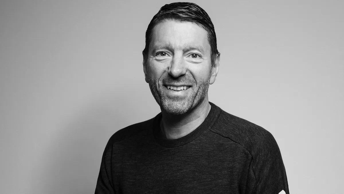 A black and white portrait of adidas CEO Kasper Rorsted