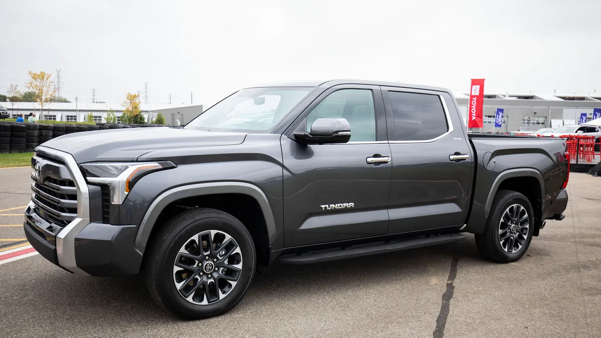 A large pickup with a sign reading "Tundra."