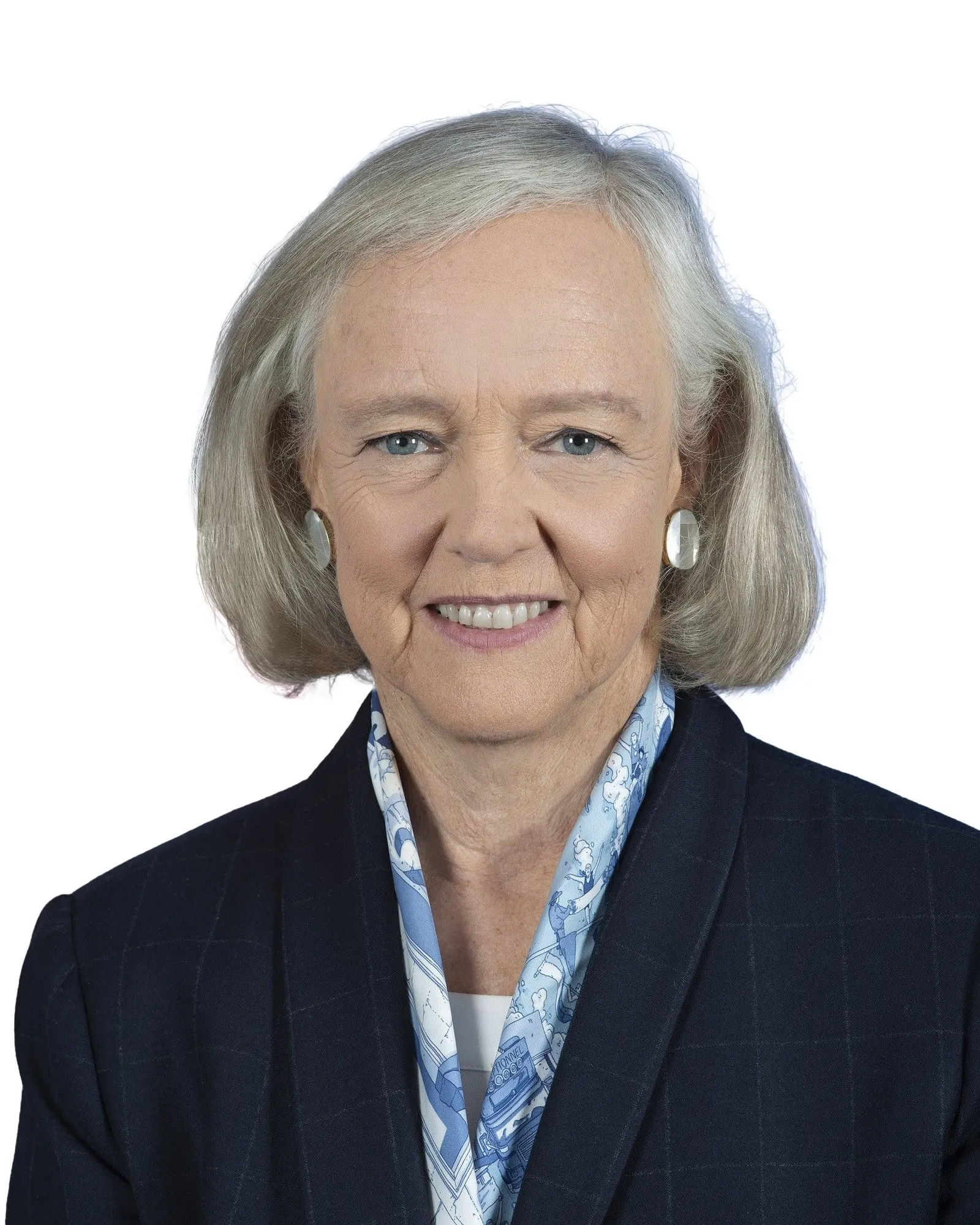Headshot of a white woman with shoulder length gray hair