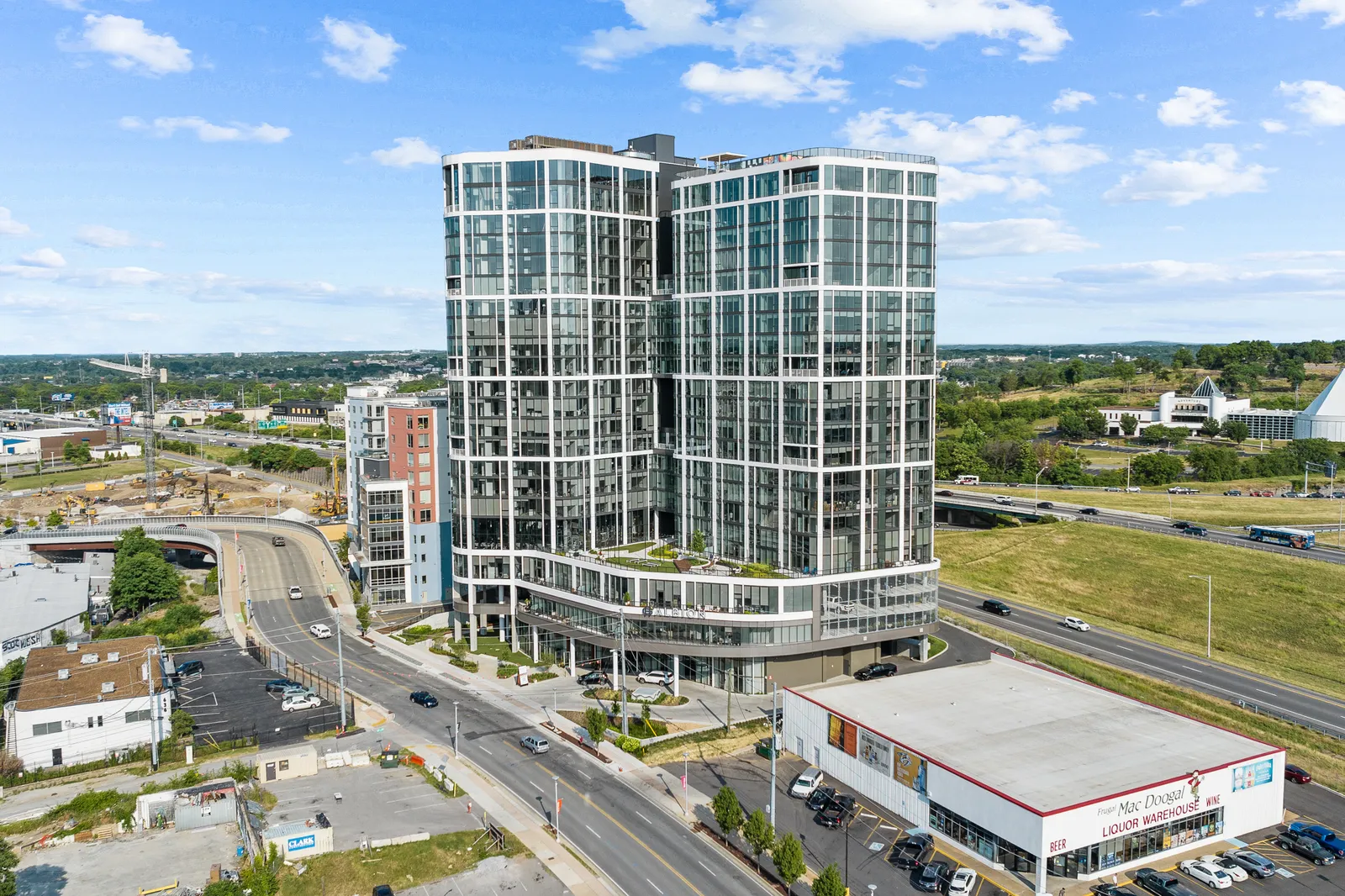 A high-rise glass apartment building.