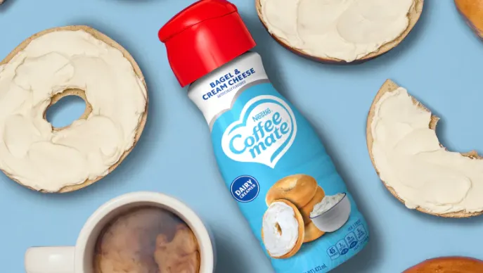 A bottle of Coffee mate's Bagel and Cream Cheese flavored dairy creamer.