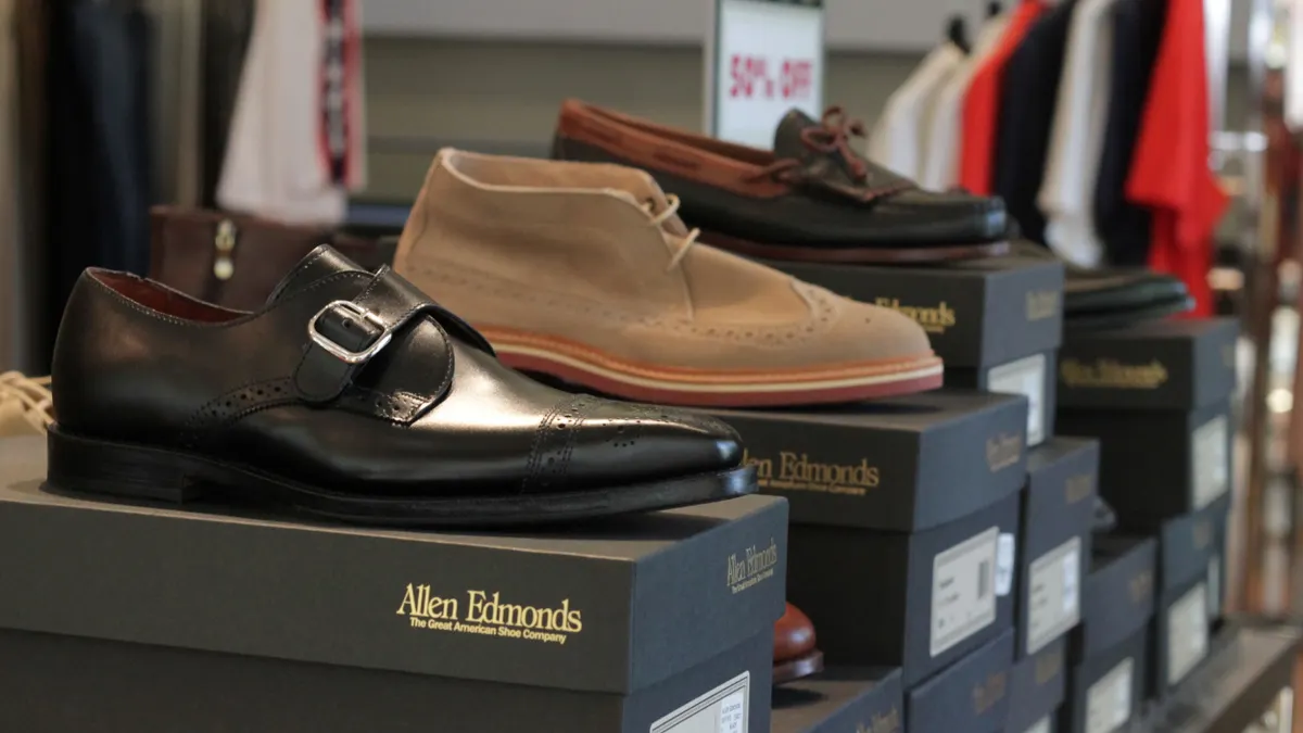 Allen Edmonds shoes are displayed in a store.