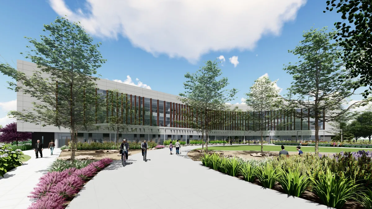 A render of a medical office building, with green space and trees in the front. The building is covered in windows.