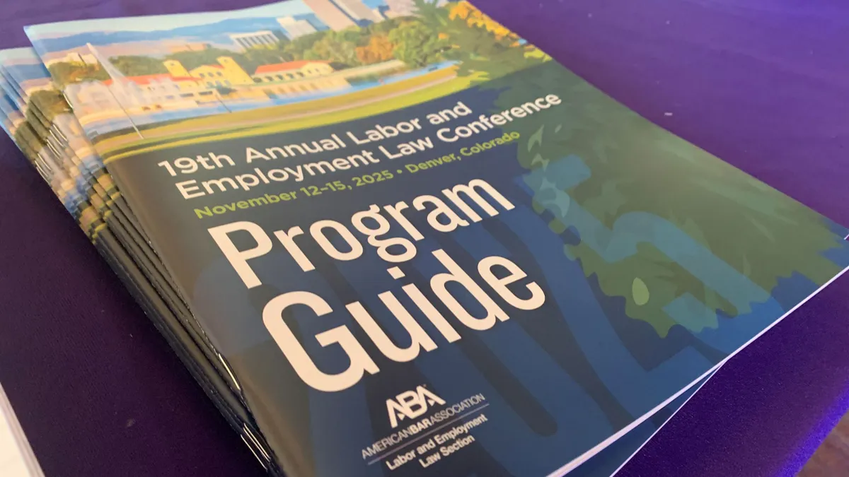 A stack of programs for the ABA's conference sits on a table.