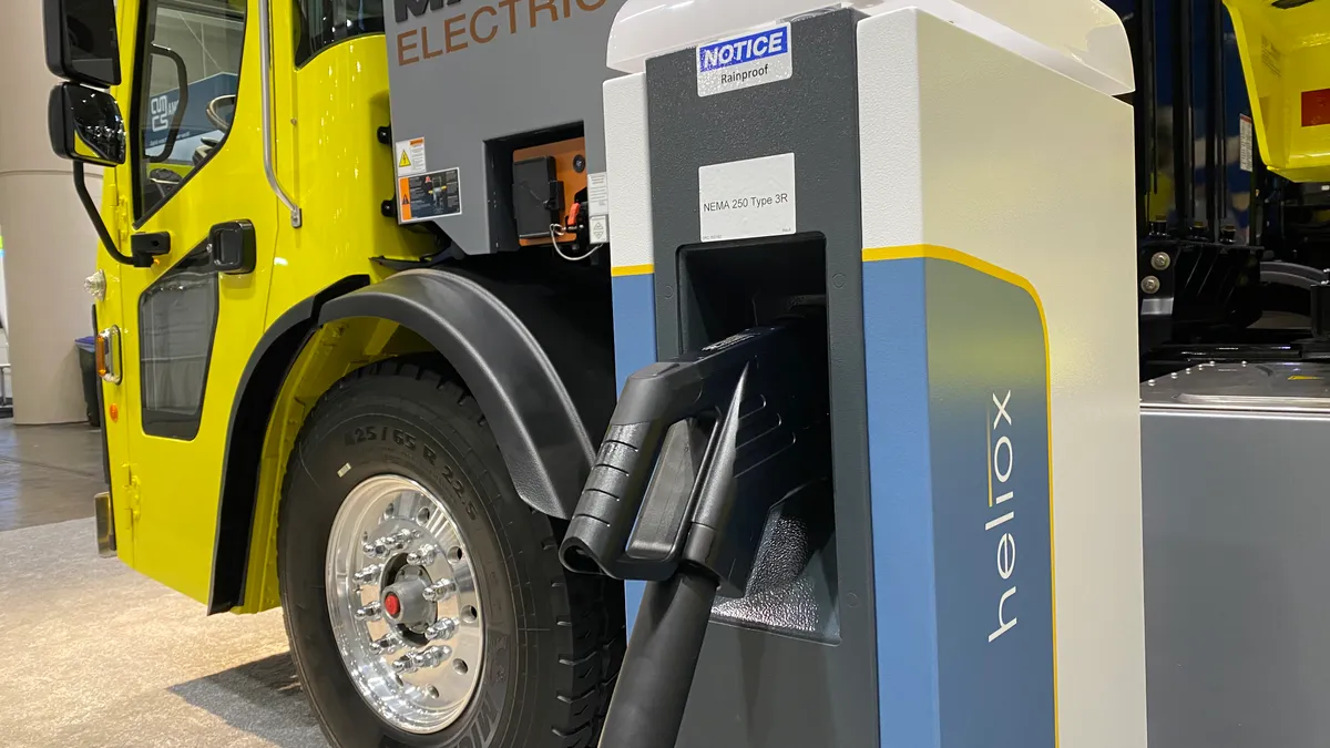 A Heliox electric charging port connects to a Mack Electric heavy-duty vehicle