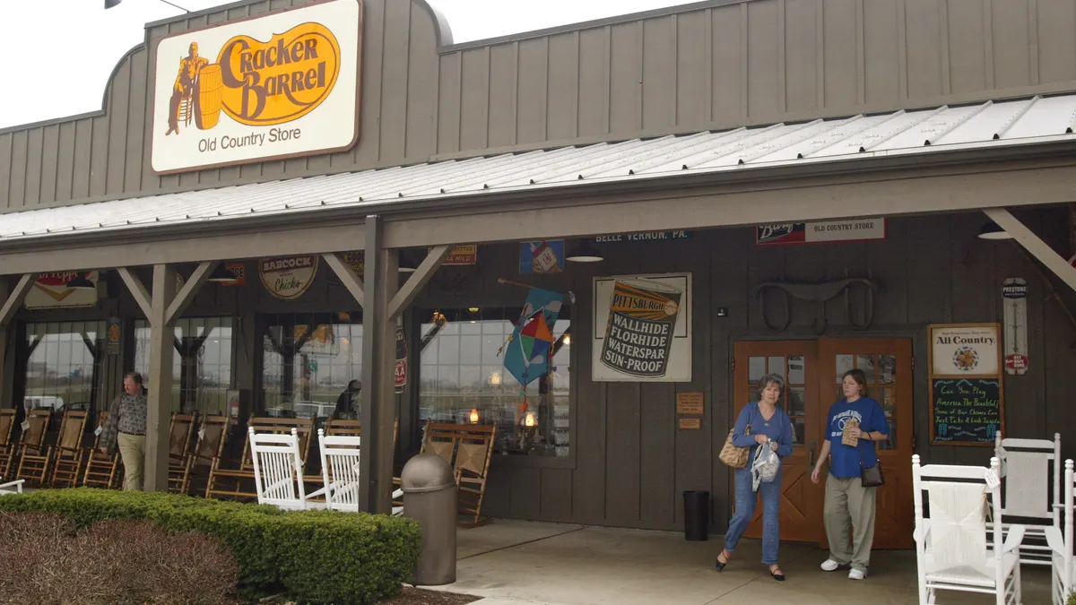 Customers depart a Cracker Barrel storefront