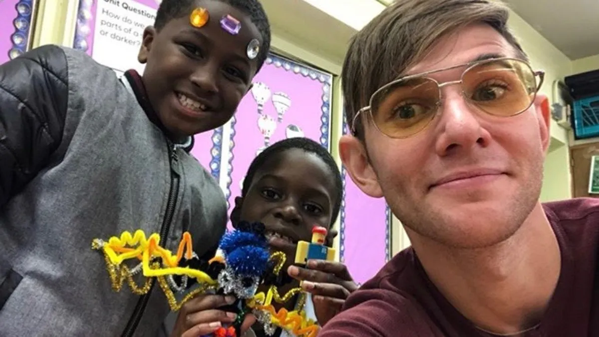 An Eye-to-Eye mentor poses with students at P.S./I.S. 76, Asa Philip Randolph School for the Humanities, in New York City on Oct. 19, 2019.