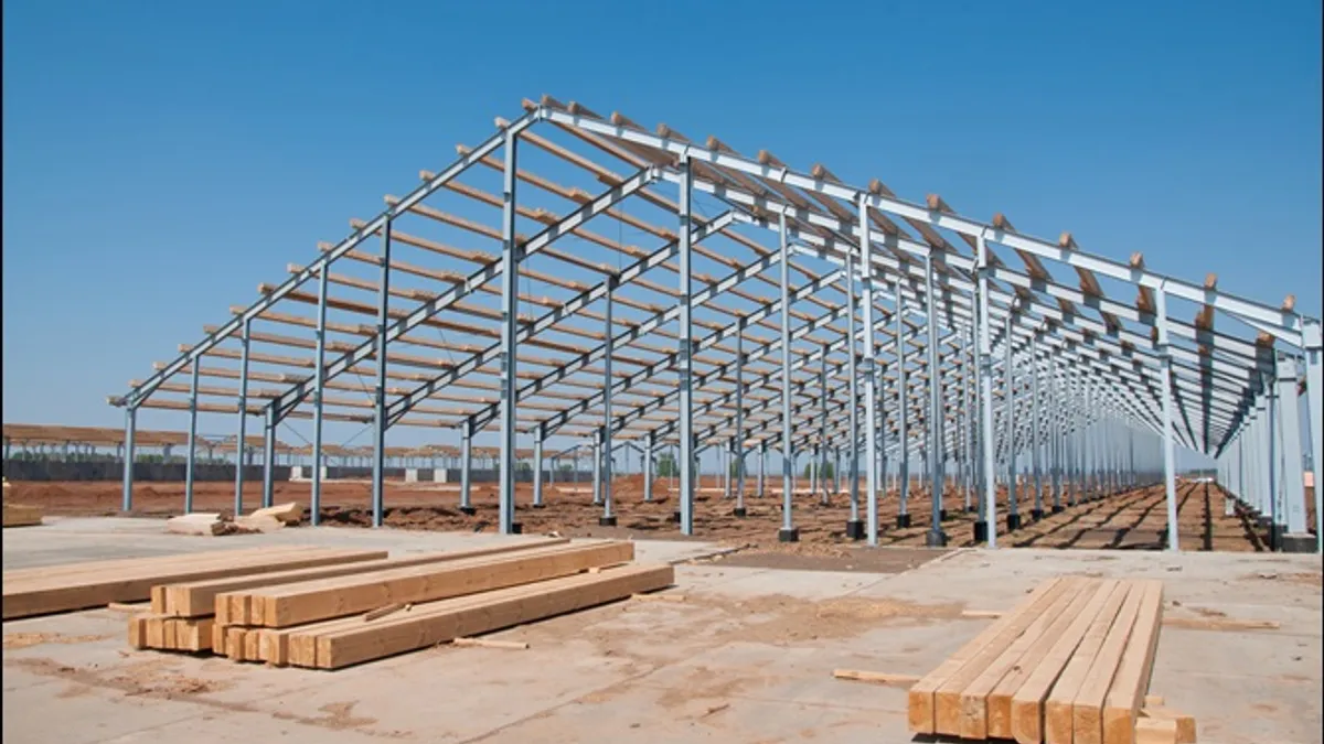 Wooden beams on steel structure for further construction. Metal frame for the installation of insulation panels.