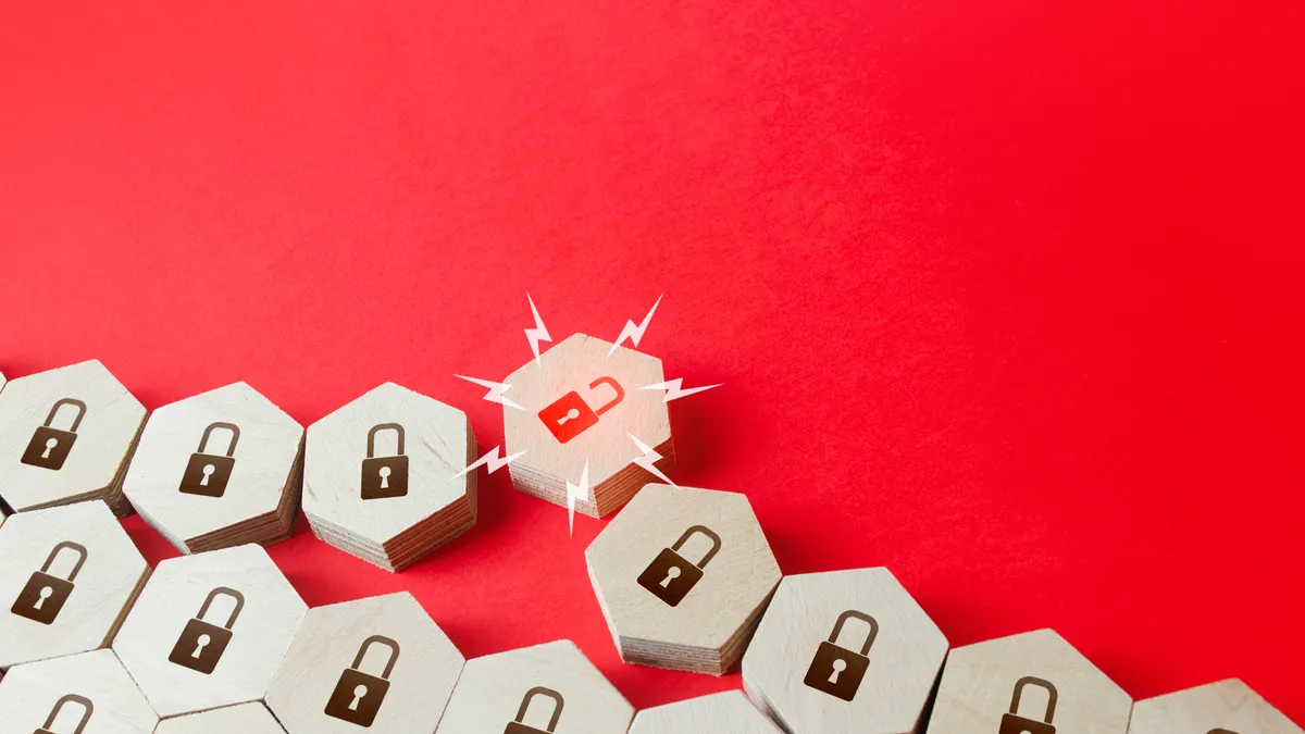 A series of hexagonal blocks with locks on them, one of which is broken, with a red background.