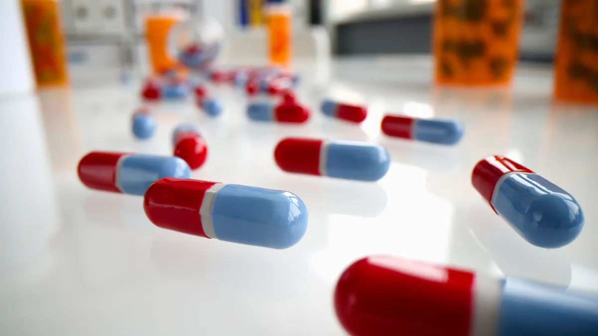 Blue and red pill capsules scattered on a table