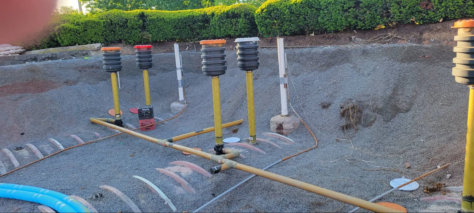 A photo of a partially uncovered underground storage tank.