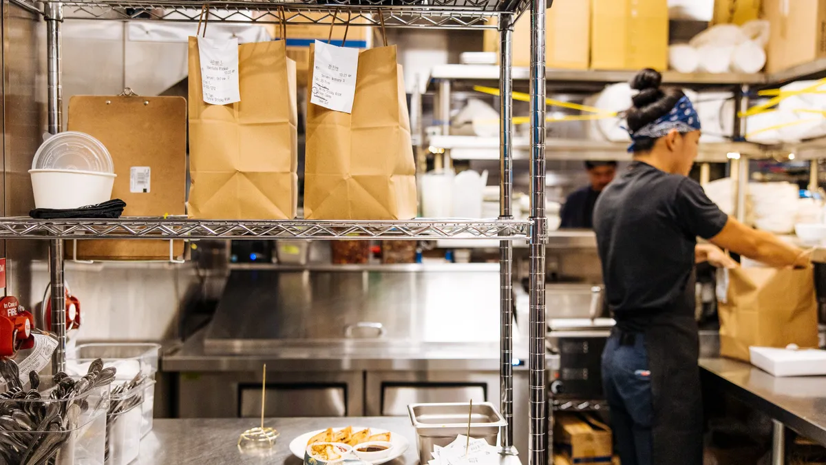 A photo of bags of food ready for delivery.