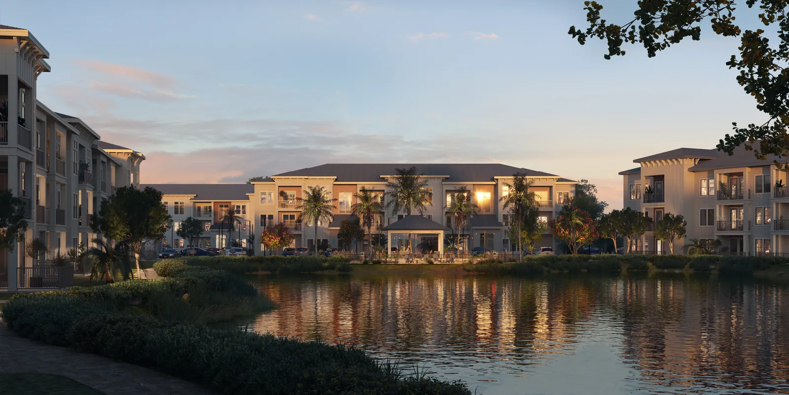 A series of mid-rise buildings arranged around a pond.