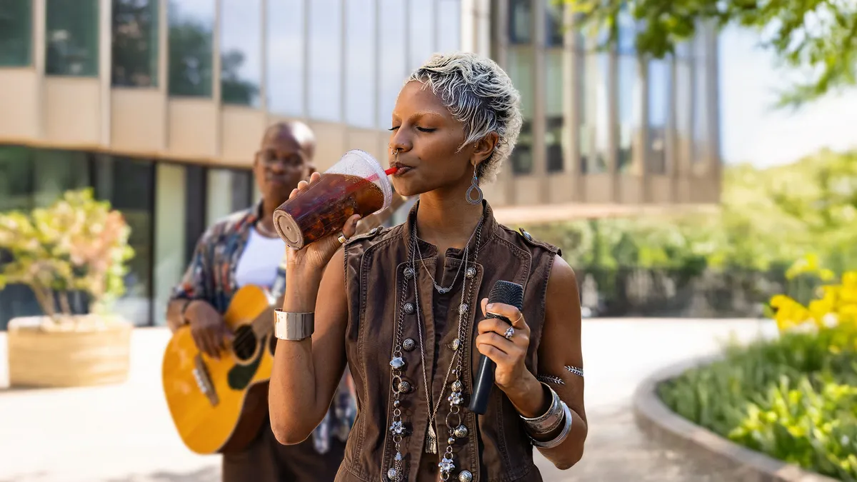 Woman drinking Folgers
