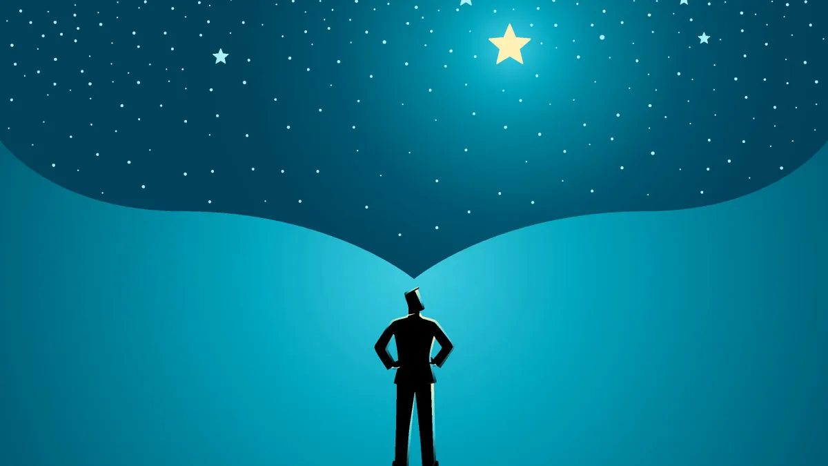 Man standing with the open space above him as a representation of his big dream