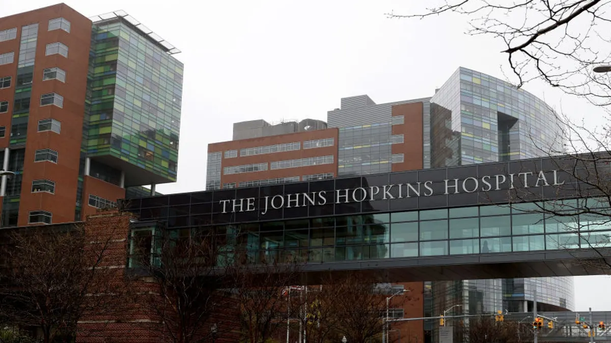 The Johns Hopkins Hospital logo on a Baltimore building.