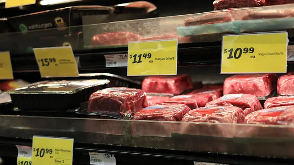 Meat is on display on a grocery store's shelves