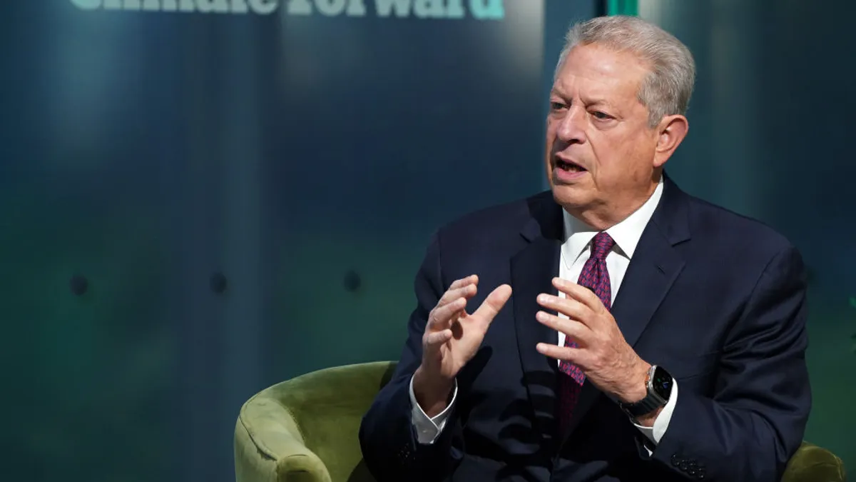 Al gore speaks onstage at a climate summit.