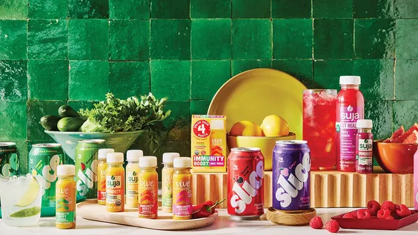 A display of Suja Life's products, including Suja, Vive Organic and Slice Soda.