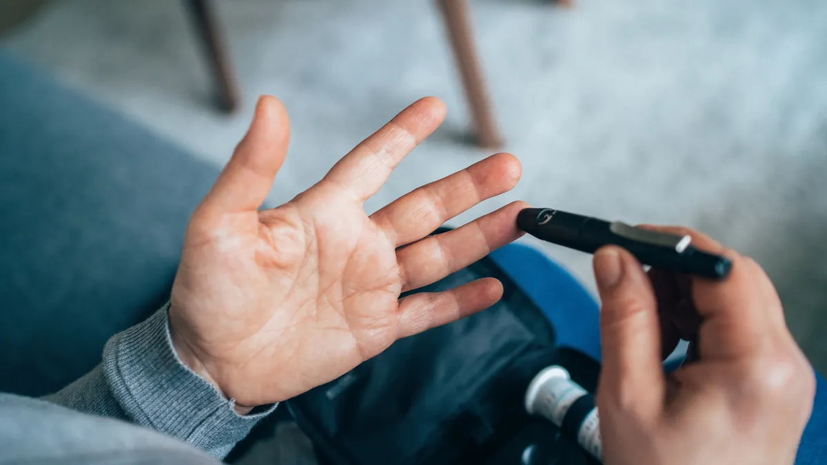 A person checks their blood sugar levels.