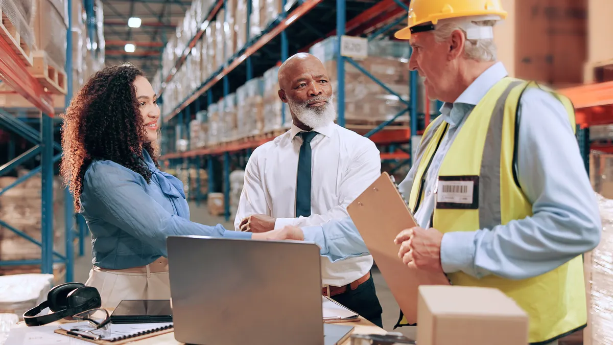 Business people, document and shaking hands in warehouse for logistics, meeting for supply chain collaboration