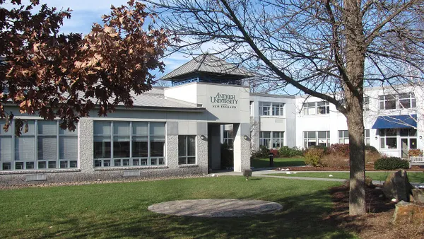 A white building with "Antioch University" on its front.