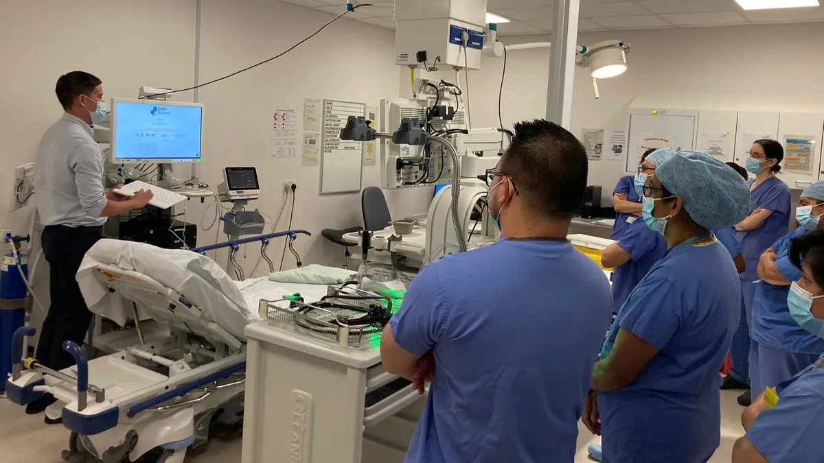 An Odin technician installing an AI endoscopy device at a hospital in Britain