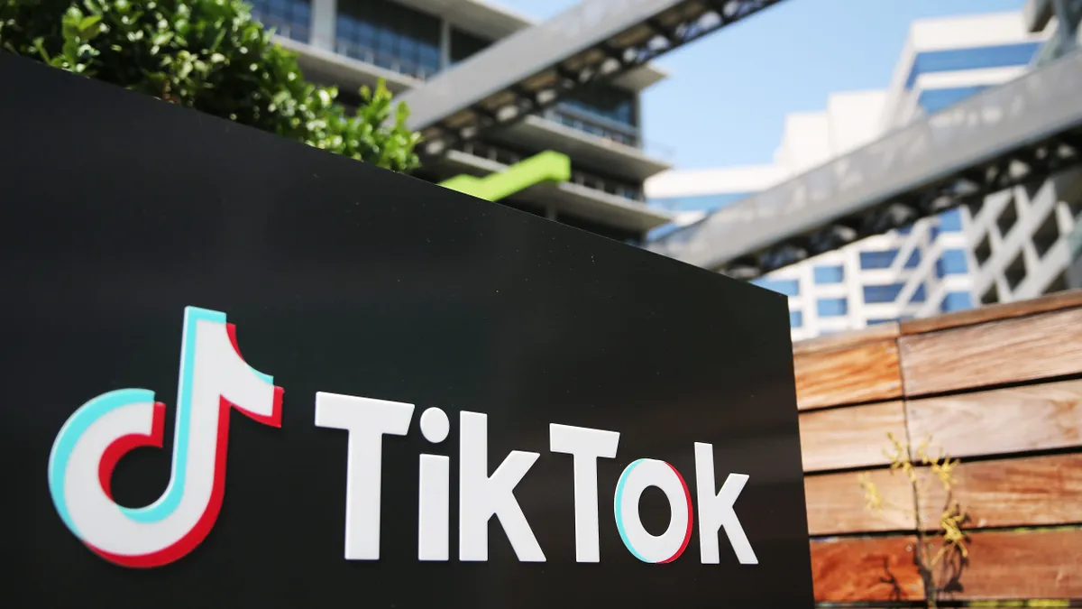 TikTok sign outside of office building.